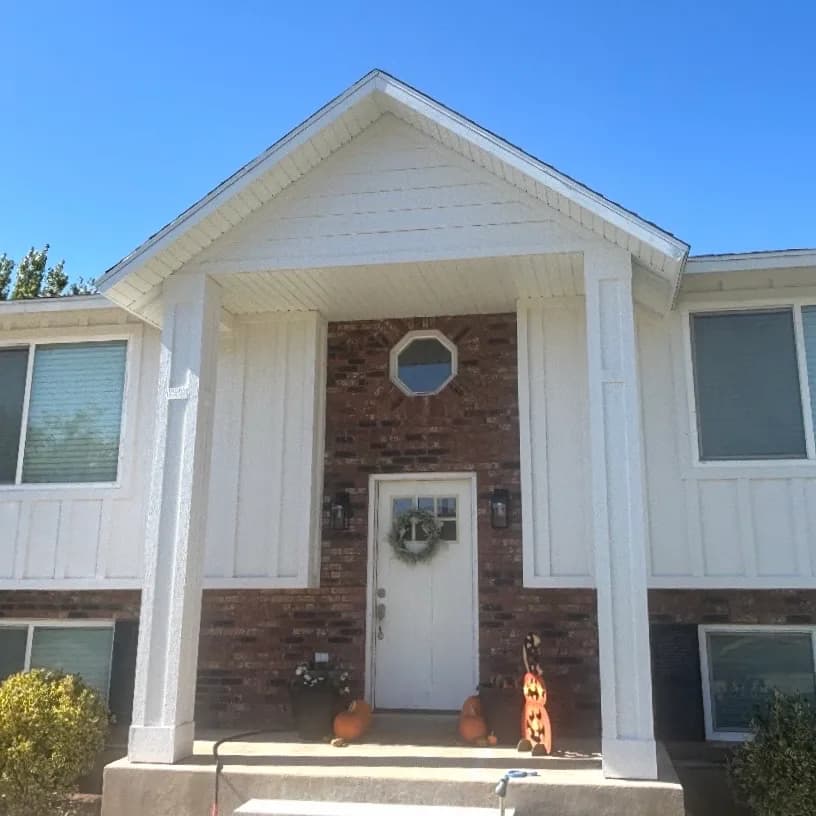 Home entrance with board and batten siding